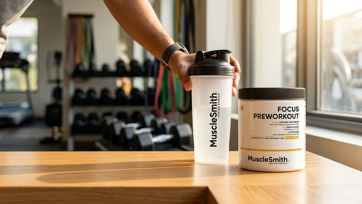 A lifter holding a shaker bottle next to a tub of Muscle Smith Focus Pre-Workout in a bright gym setting.