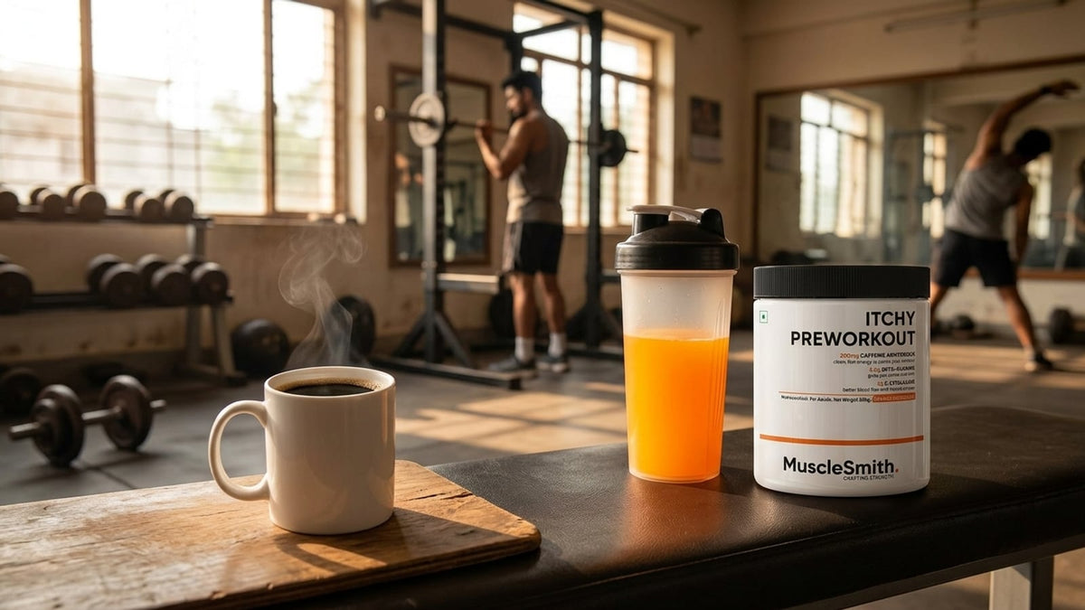 A mug of black coffee next to a shaker bottle and a tub of Muscle Smith pre-workout on a gym bench.